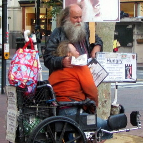 Norman prays with John at Powell and Market St. 